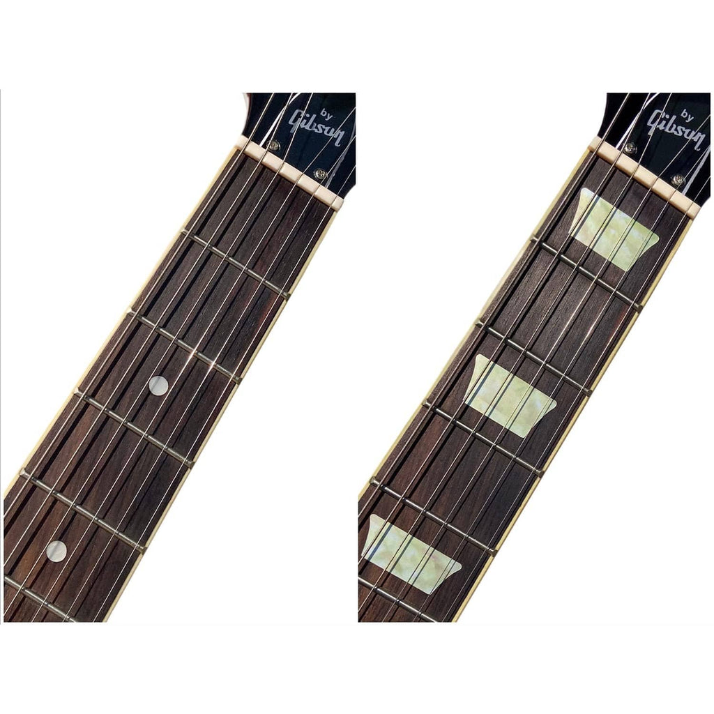 Two views of guitar neck with pale rectangular inlay stickers on frets