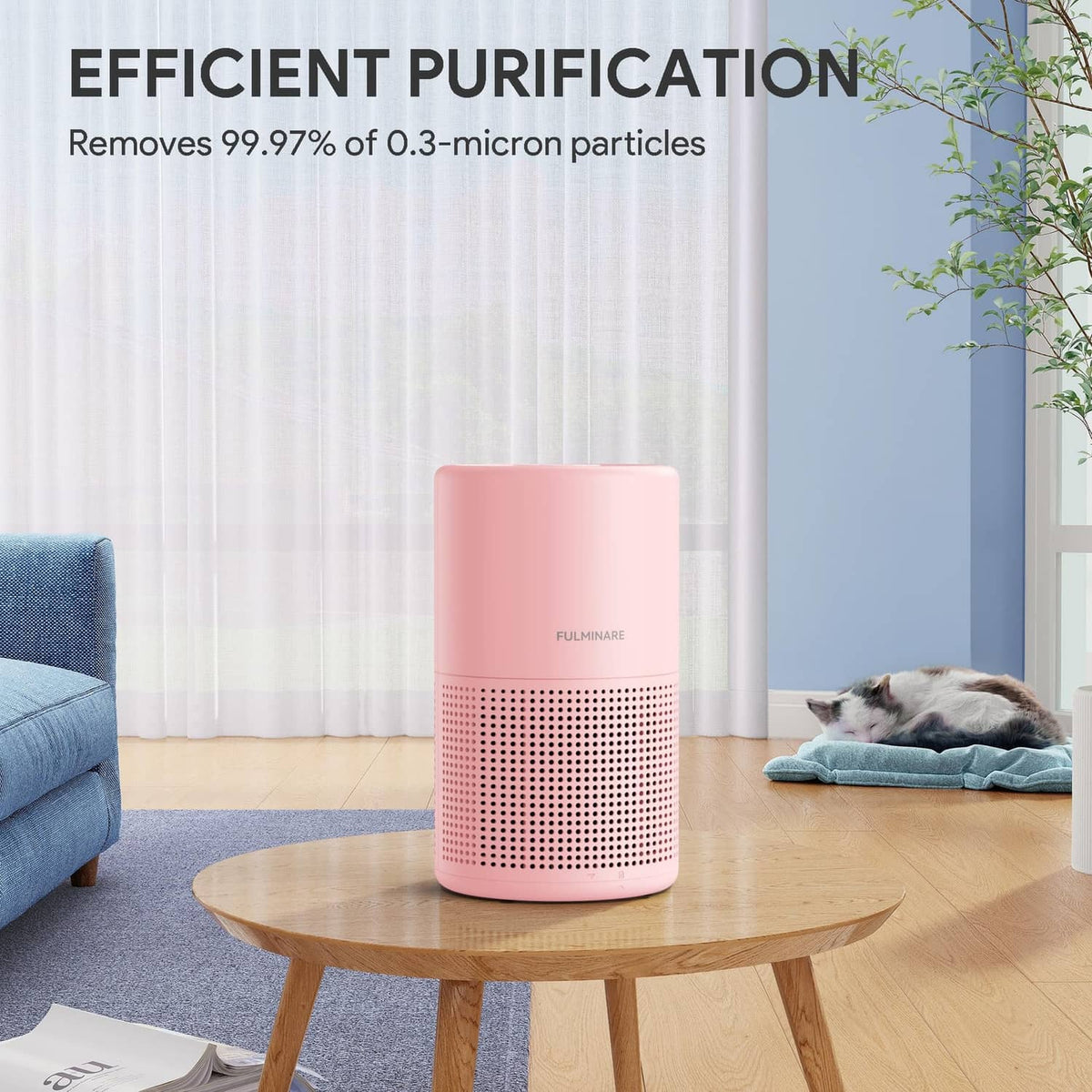Pink air purifier with perforated grille near a couch