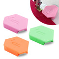 Set of three magnetic fabric seam guide blocks in pink, green, and orange