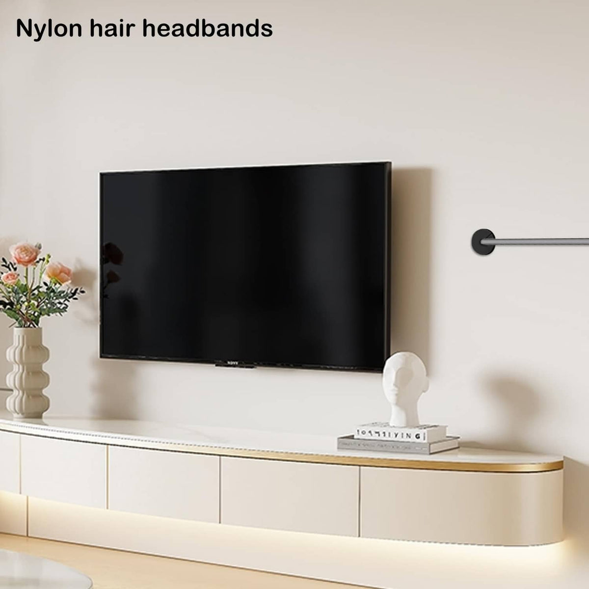 Black wall cable pass-through grommet with circular top and raised cable opening