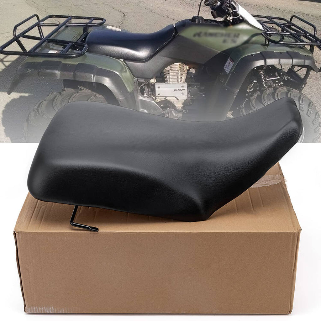Black ATV seat on cardboard box, contoured single-piece padded cushion
