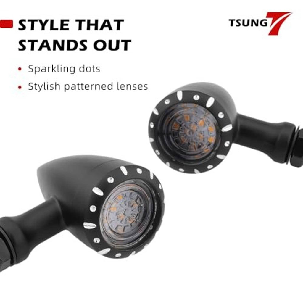 Two black motorcycle bullet LED turn signals with sparkly dot accents on lenses