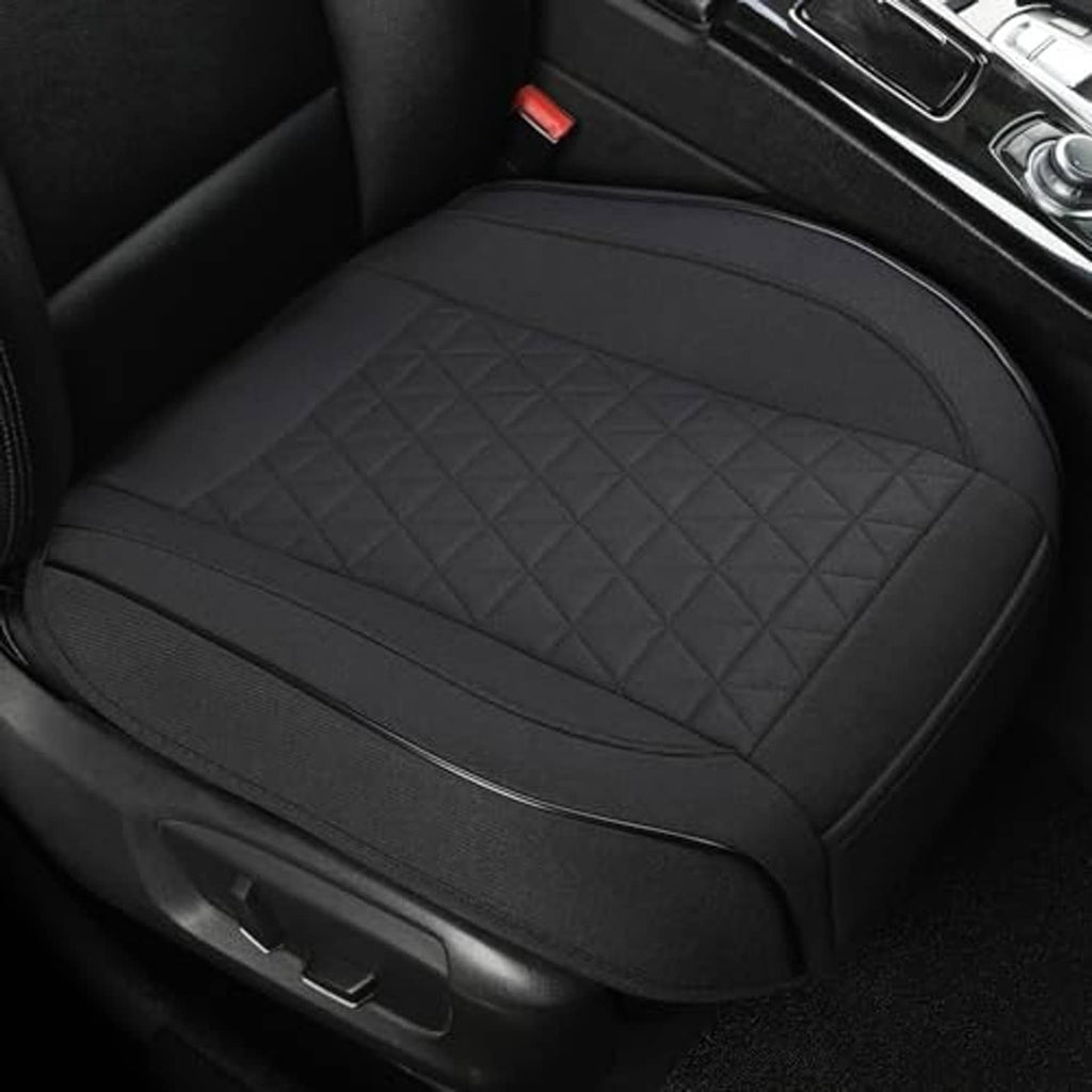 Black front seat cover with triangular quilted surface and padded edge stitching.