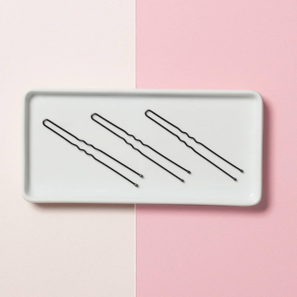Set of three black 3-inch hair pins on display card, U-shaped crimped design