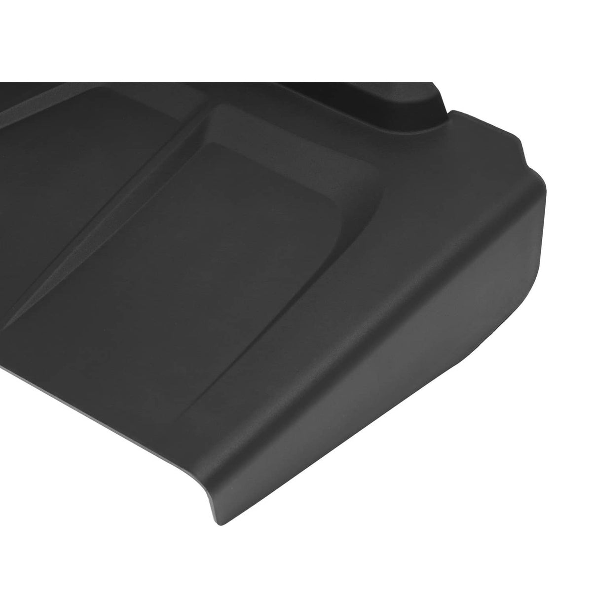 Close-up of black discharge chute with molded ridges and smooth curved top