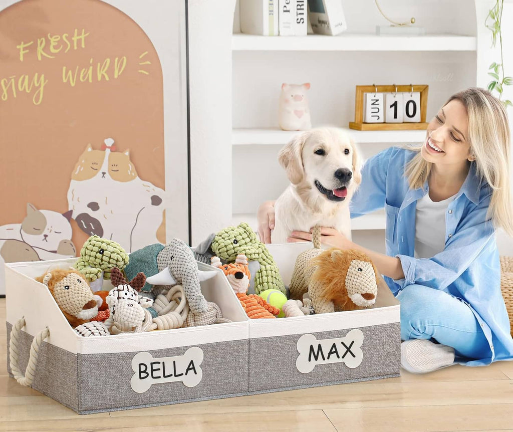 Grey collapsible fabric dog toy basket with plush toys, top open with front label panels