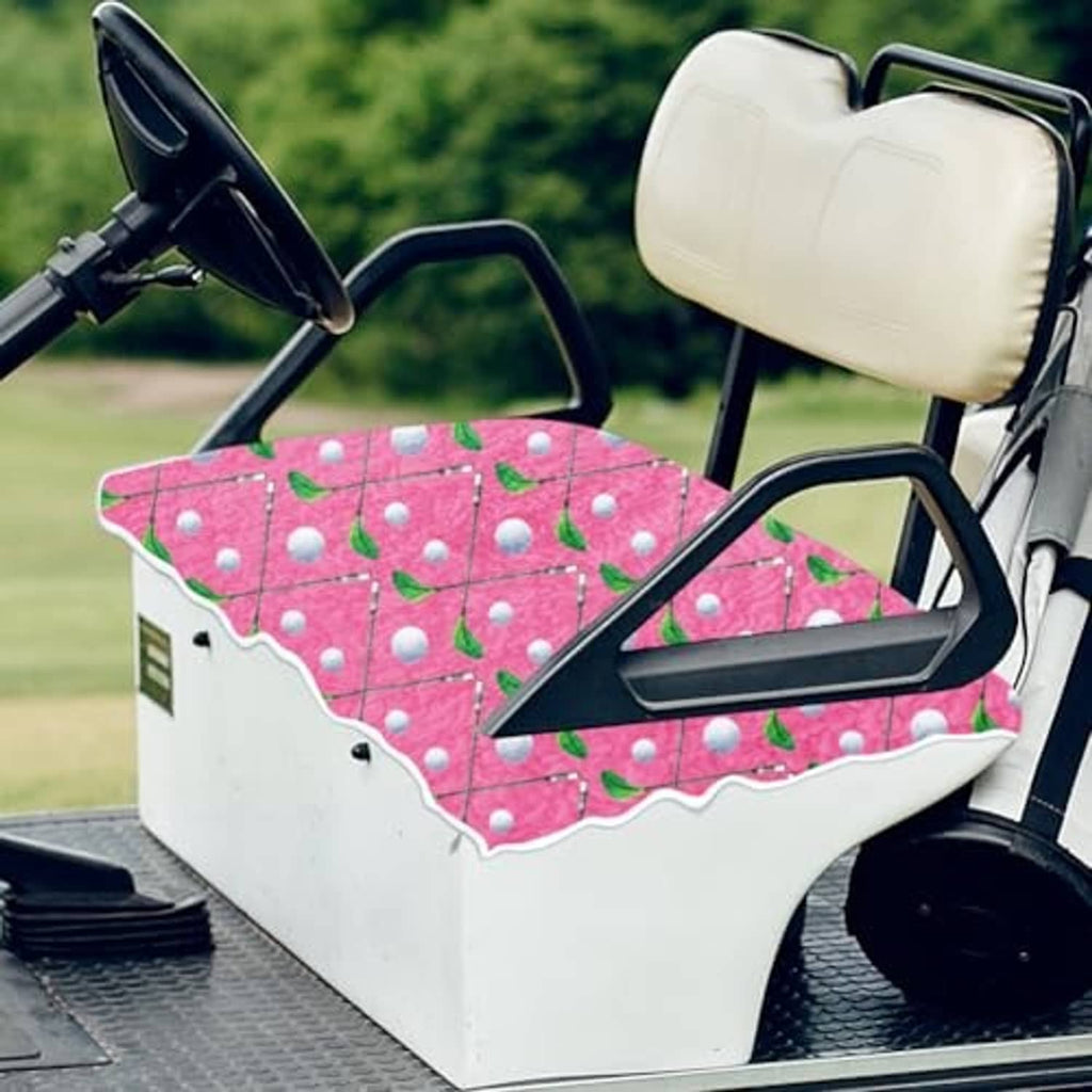 Golf cart seat cover in pink with leaf-and-dot pattern, scalloped edge detail