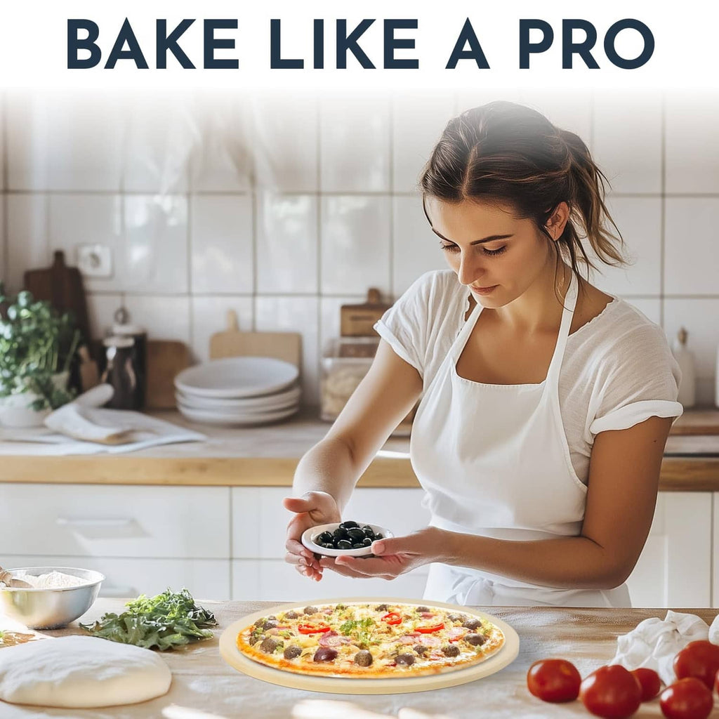 Person placing a pizza onto a beige round pizza stone on a kitchen countertop.