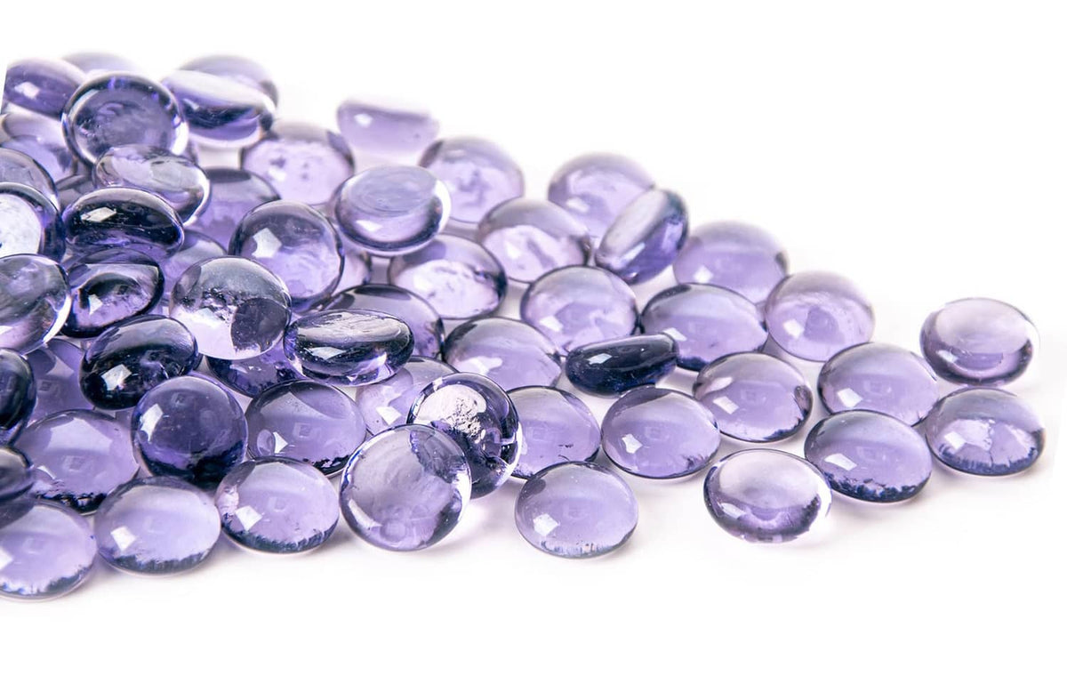 Purple mini glass gems, round and faceted, in a mixed pile for crafts or mancala