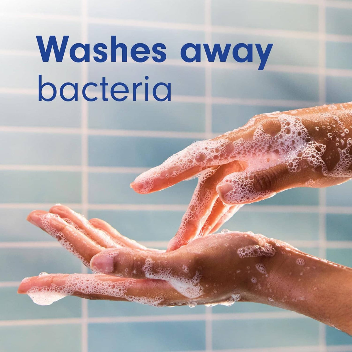 Soapy hands with foam from Softsoap juicy peach liquid hand soap