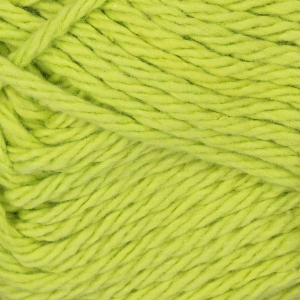 Light lime green cotton yarn close-up, twisted strands texture