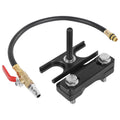 Engine valve spring compressor tool with black H-beam and air valve hose with brass fittings