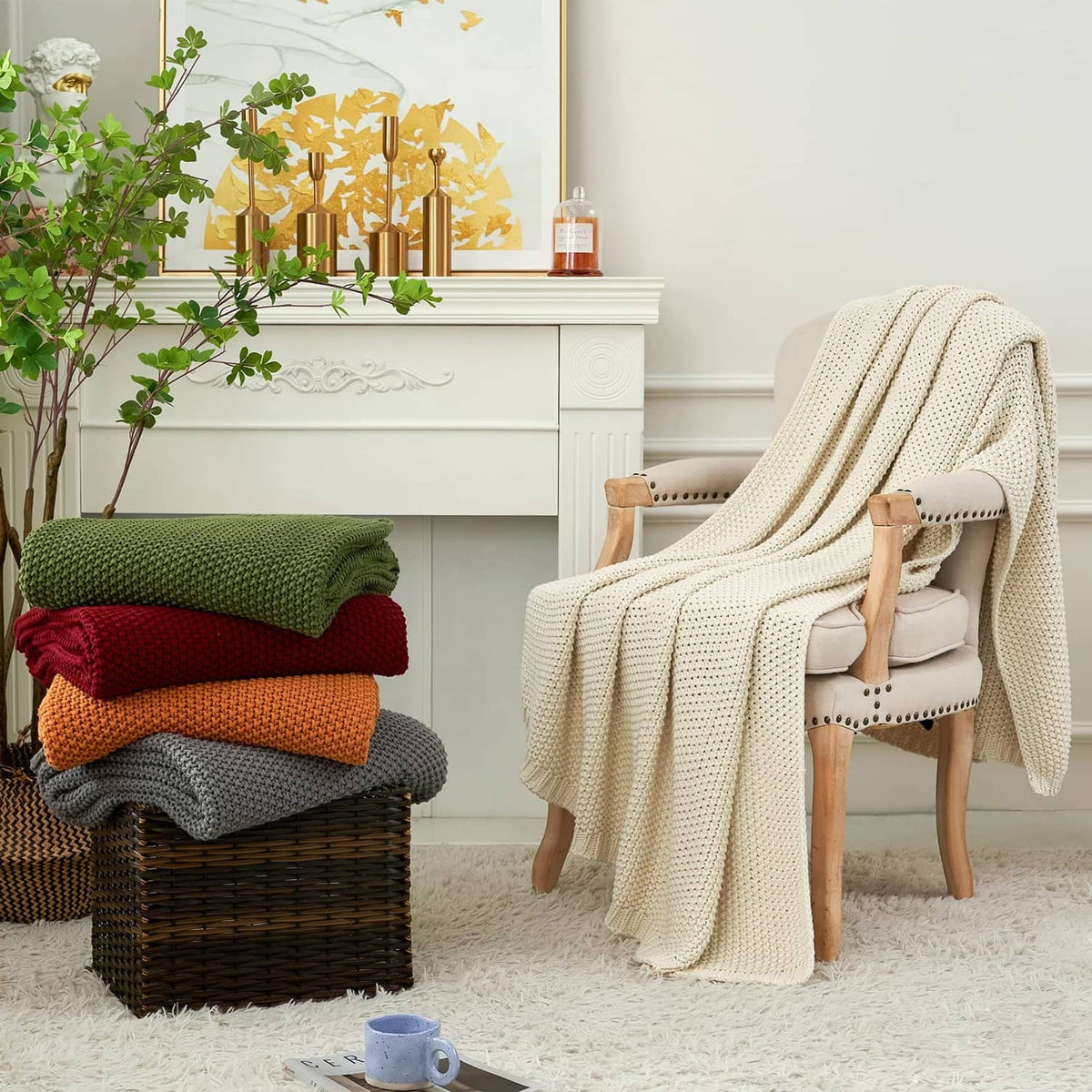 Olive green chunky knit throw blanket folded in a stack