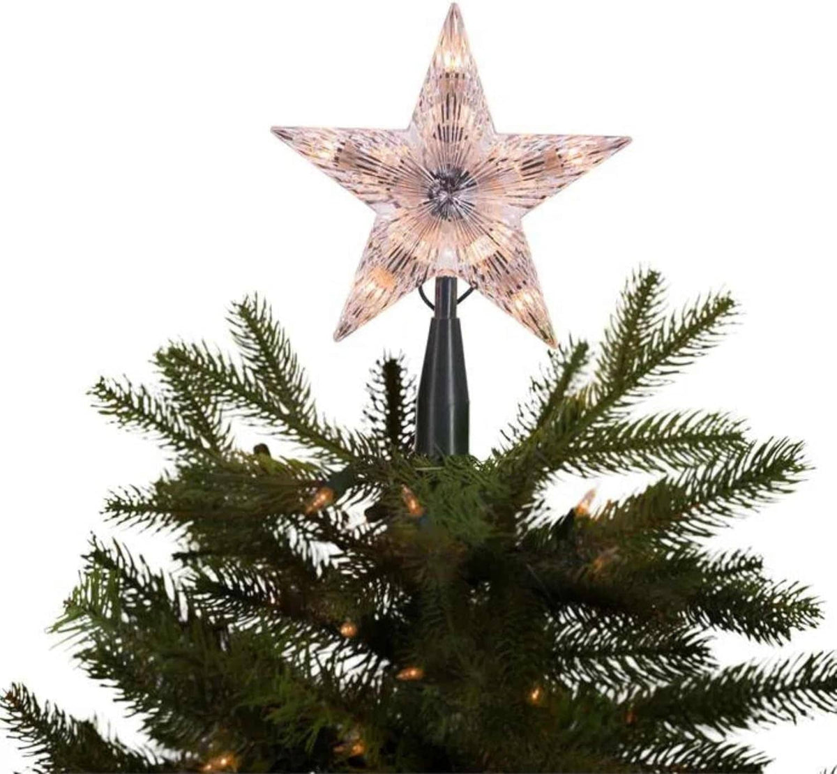 Kurt Adler clear star tree topper with warm LED lights on a Christmas tree, dark base