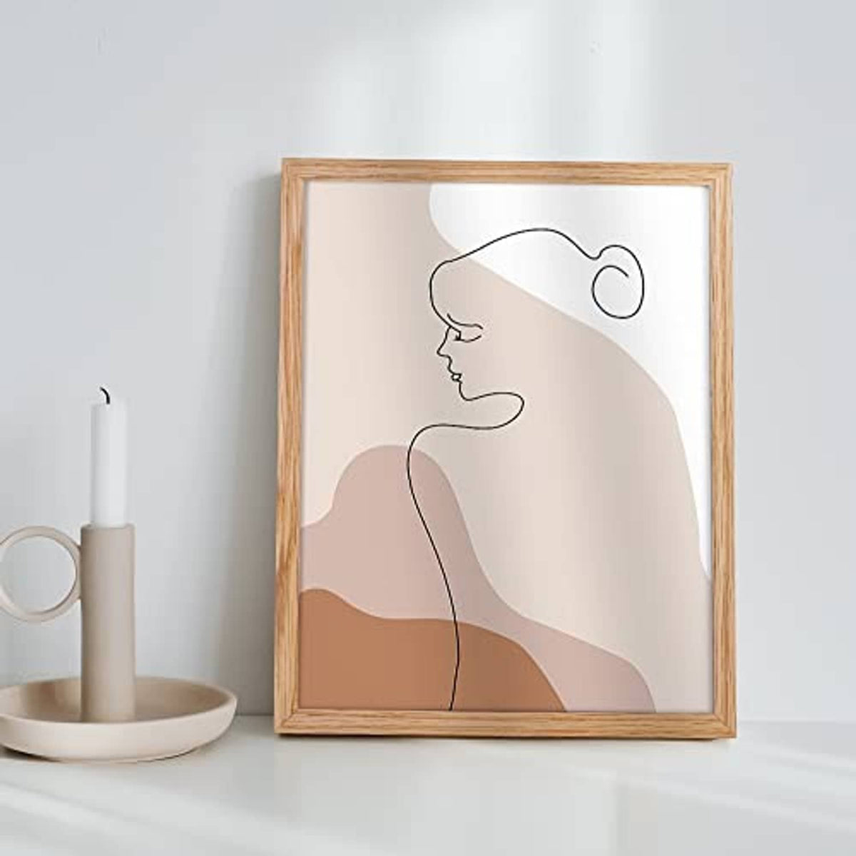 Oak wood 11x14 picture frame holding a minimalist line-art portrait print