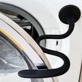 Black flexible washer door prop holding the open washer door