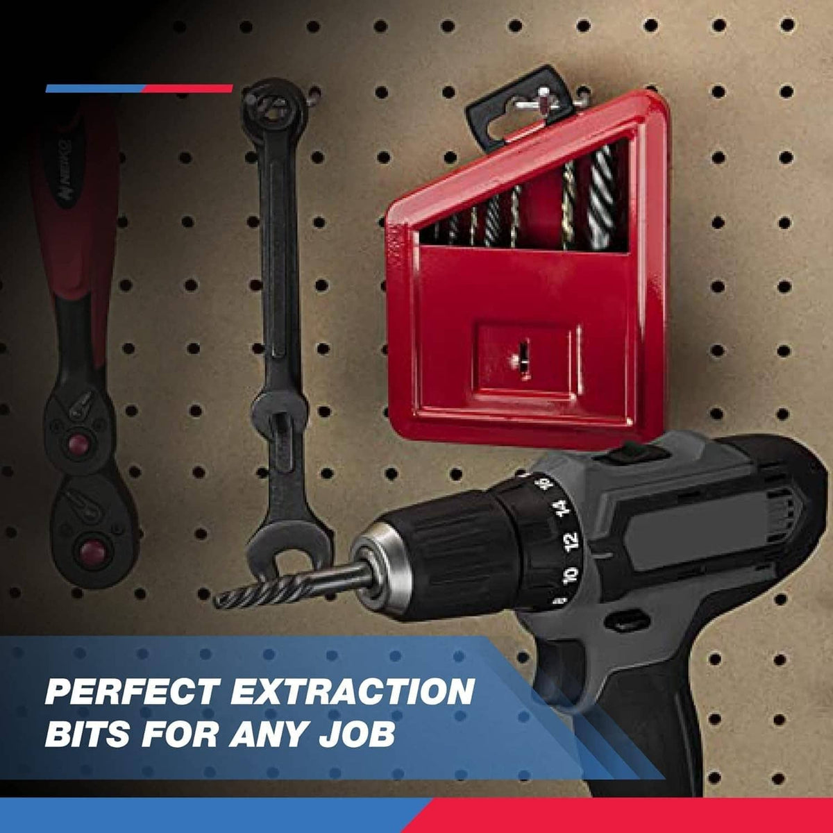 Red extractor bit set with case, drill, and wrench on a perforated work surface