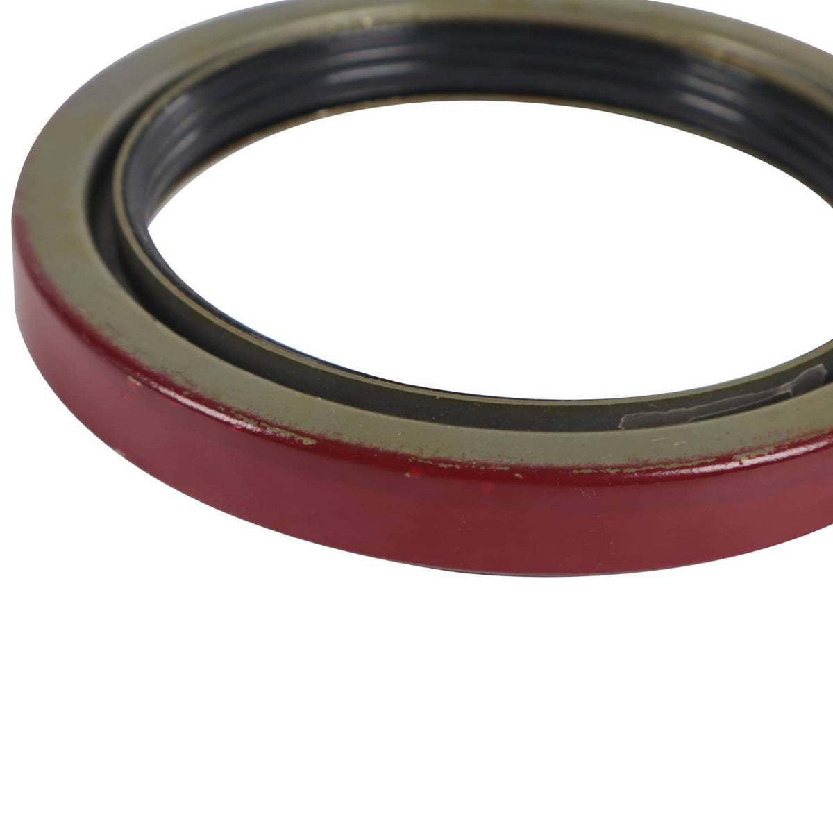 Trailer bearing seal ring close-up with red rim and black inner ring