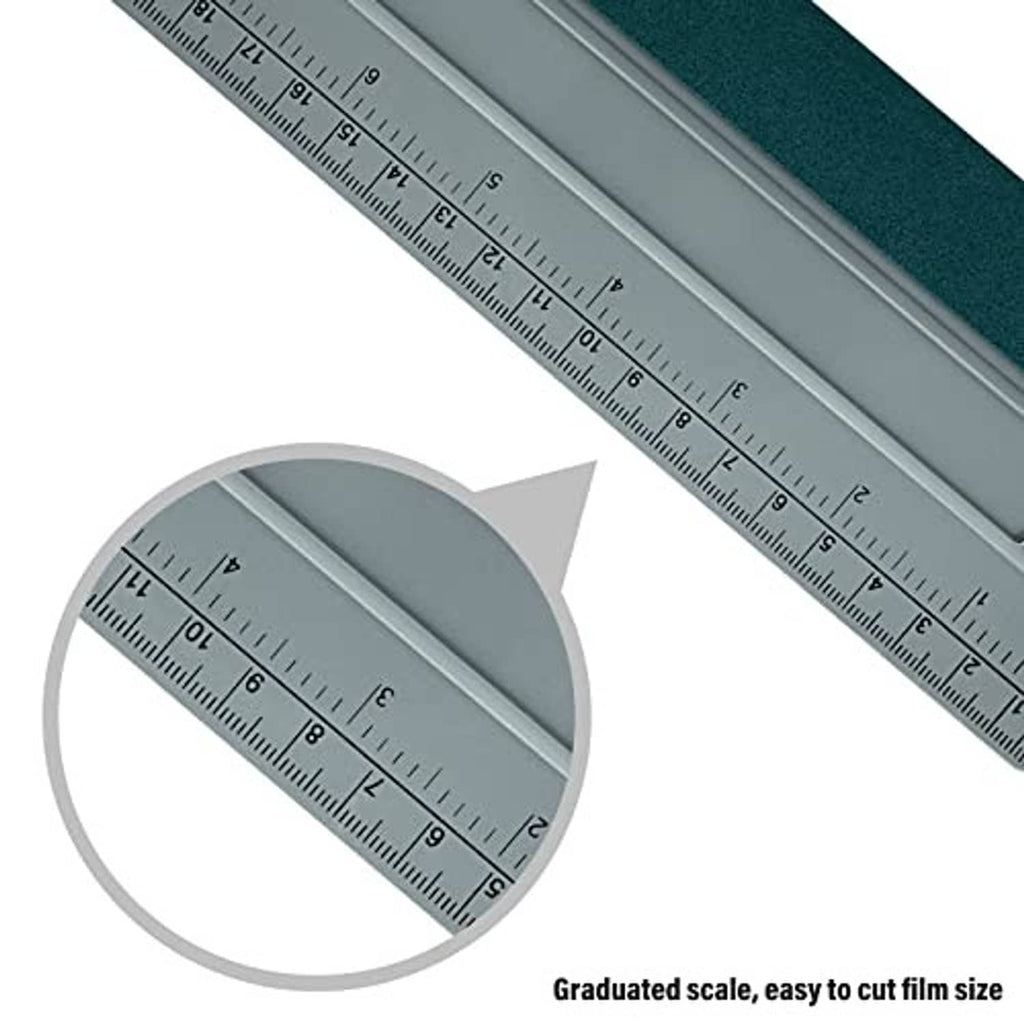 Silver ruler with graduated scale on felt squeegee base for precise vinyl cutting