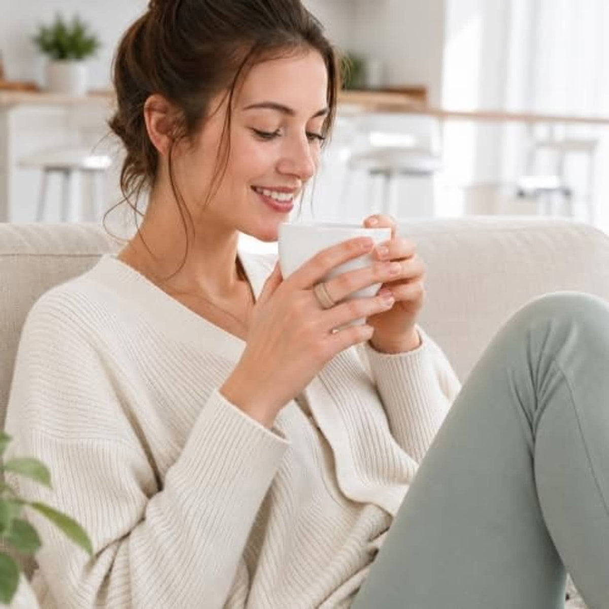Silicone ring cover not clearly visible while person holds a mug