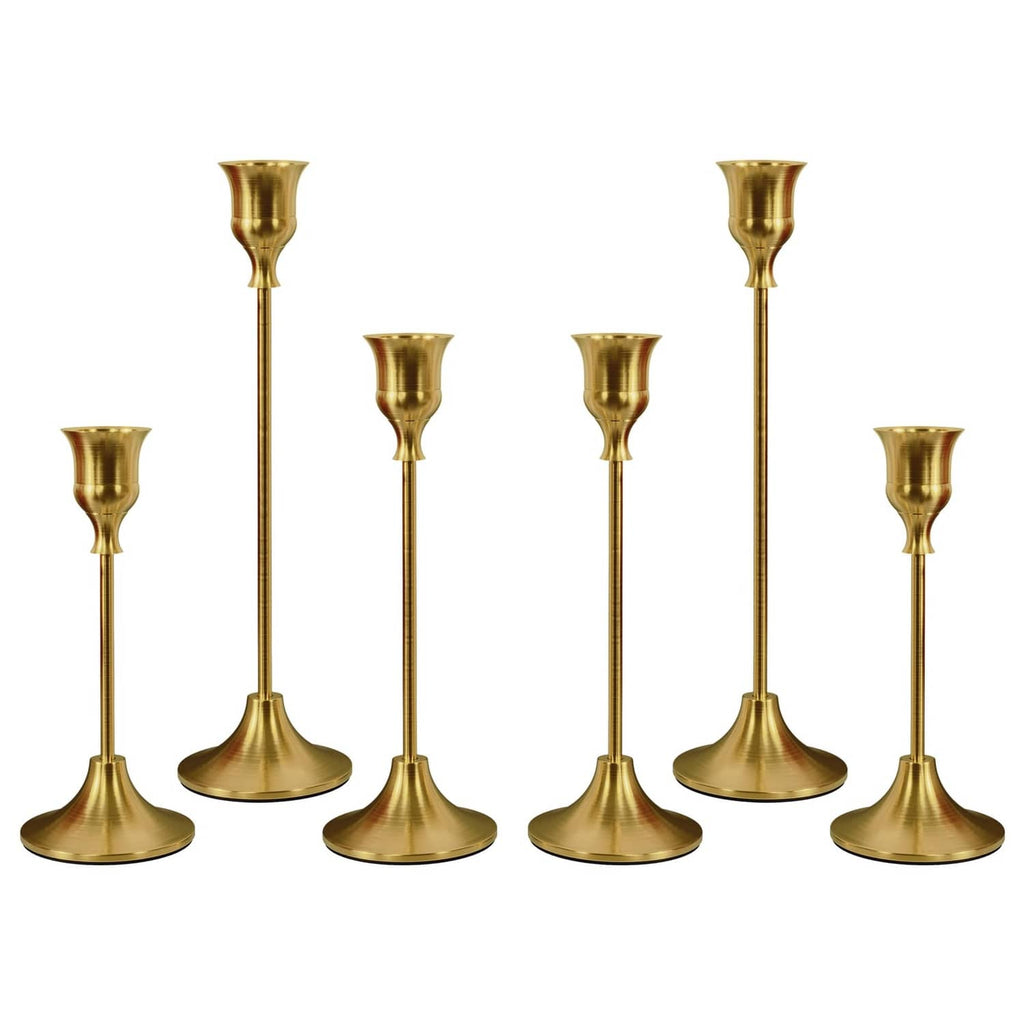 Set of six brass gold candle holders with tall stems and flared cup tops