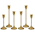 Set of six brass gold candle holders with tall stems and flared cup tops