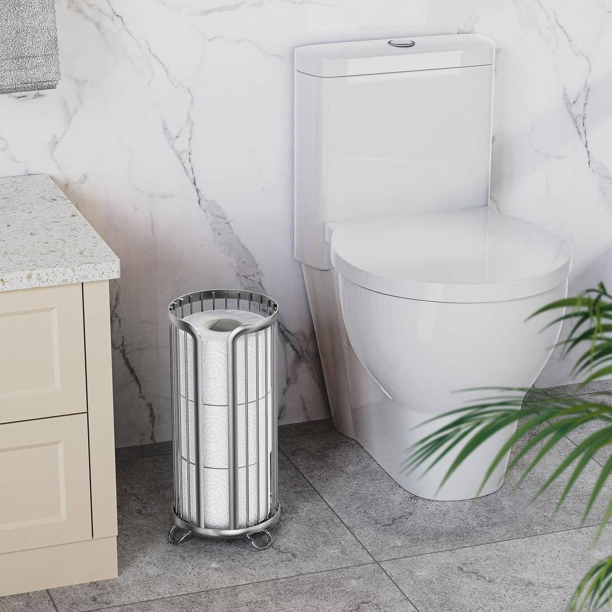 Freestanding silver toilet paper holder stand with wire cylinder sides and stable base