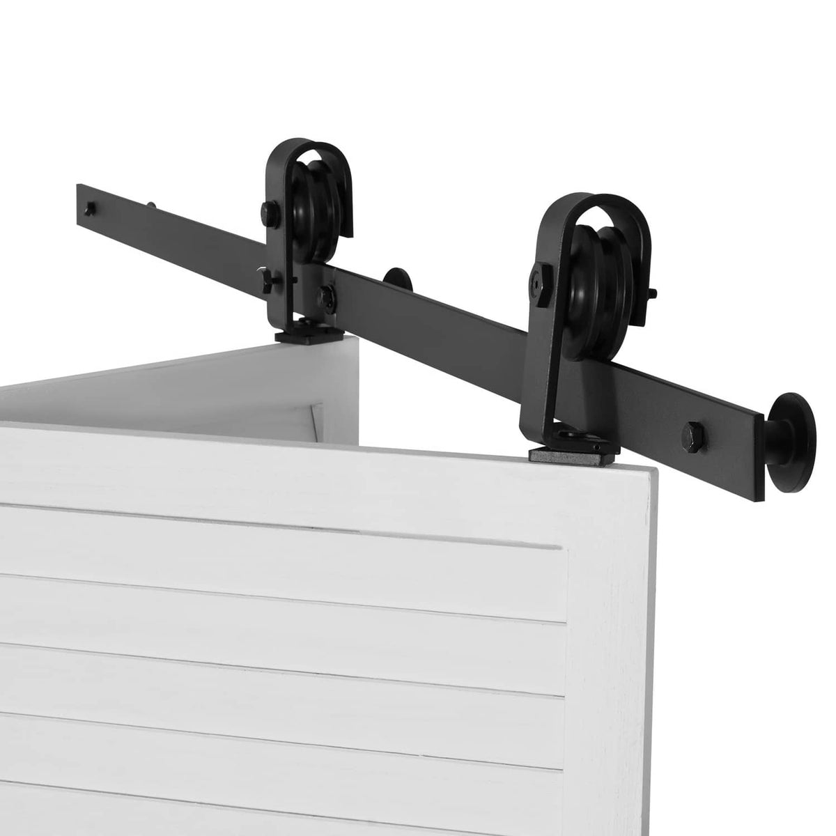 Black sliding barn door track hardware with roller hangers mounted on a bar