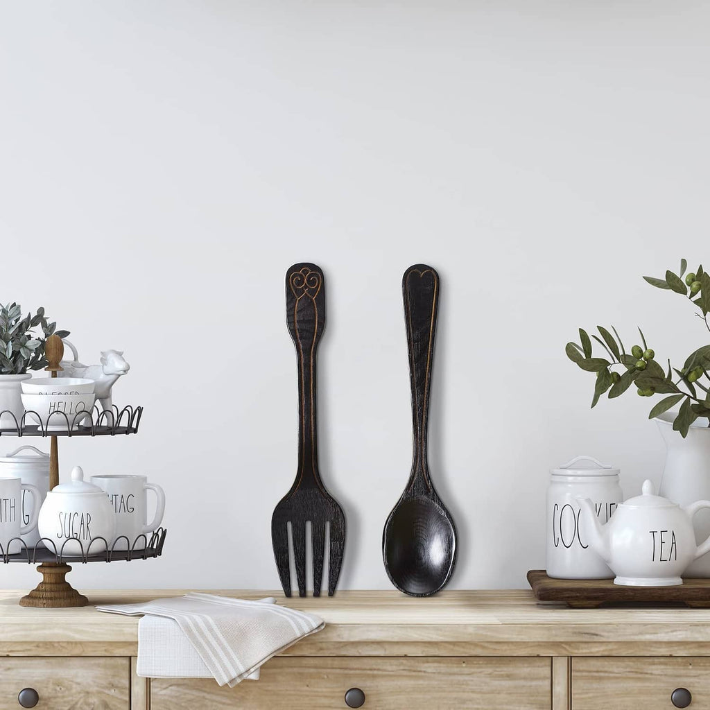 Rustic fork and spoon wall decoration set, dark metal utensils mounted on wall