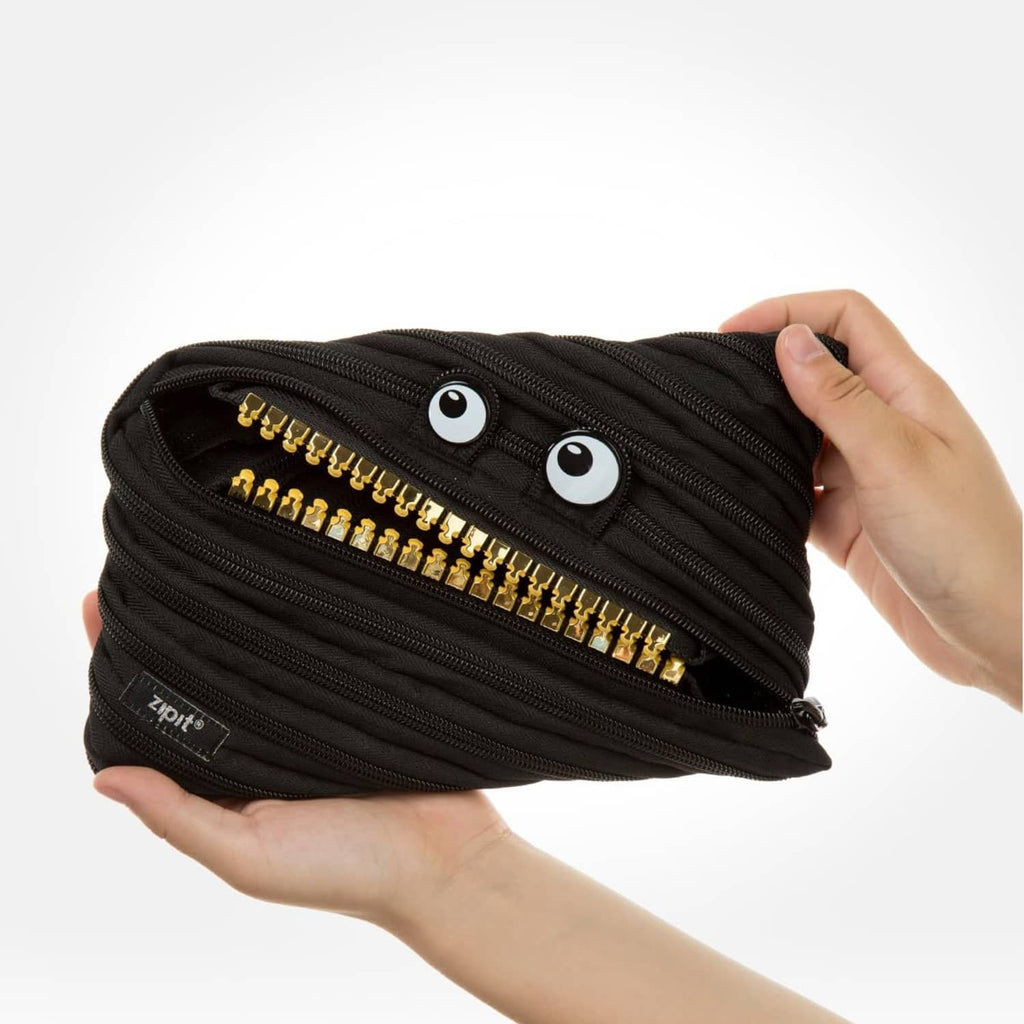 Black ZIPIT pencil case pouch with gold zipper teeth and two eye patches, side view