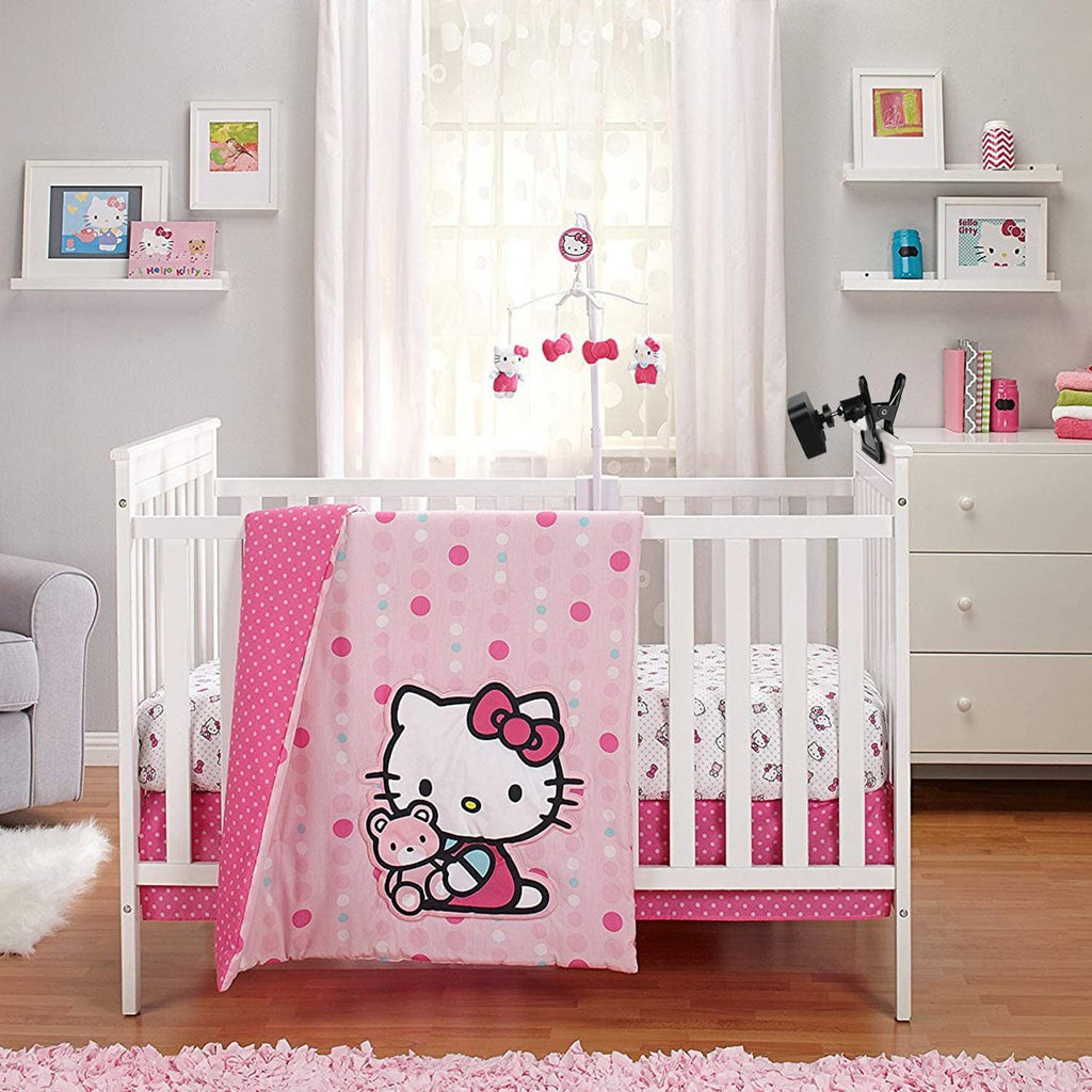 Small black clip mount holding a camera on a white nursery railing