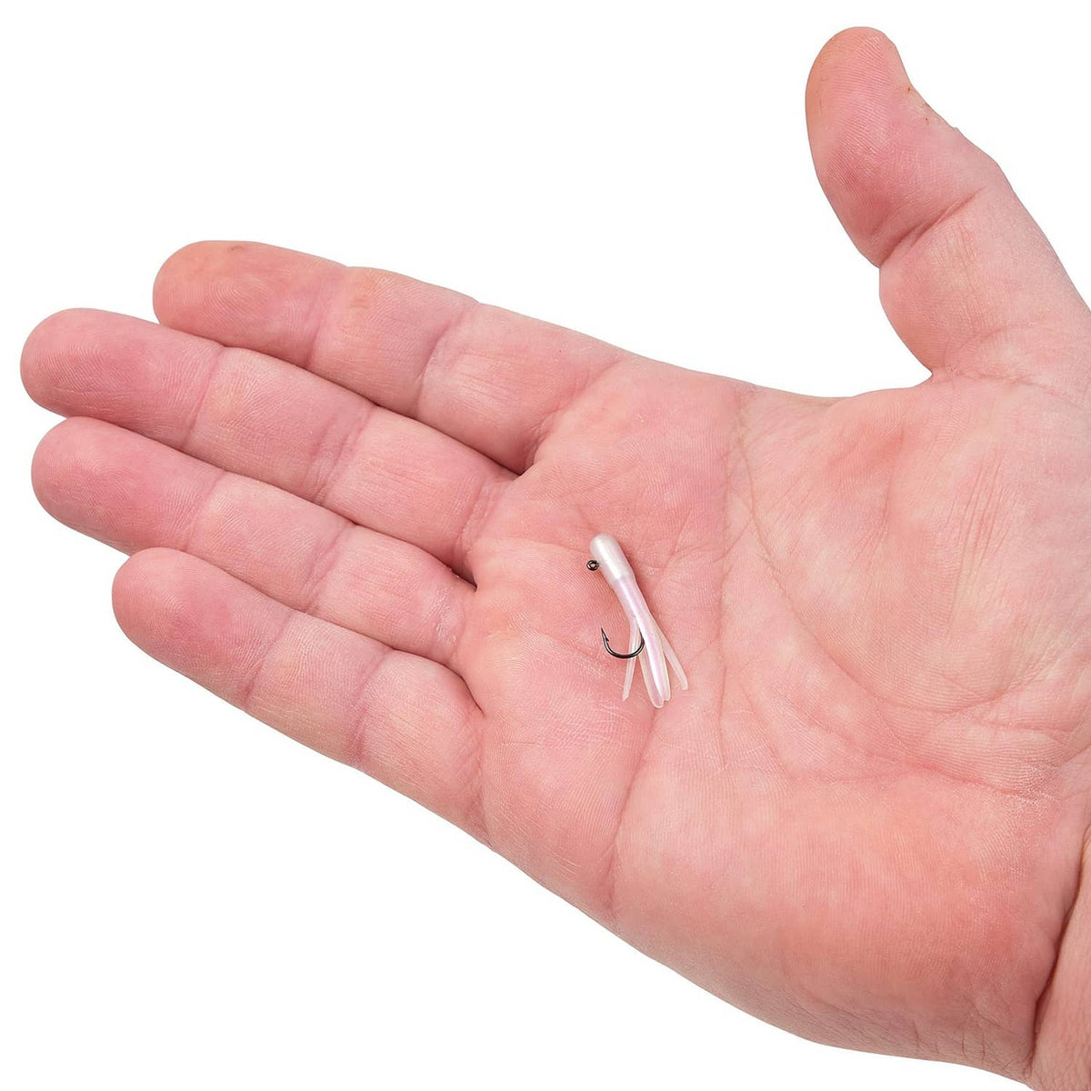Three small fishing hooks with line, held in open palm
