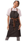 Unisex bib apron in dark charcoal/black with front pocket and brown waist tie