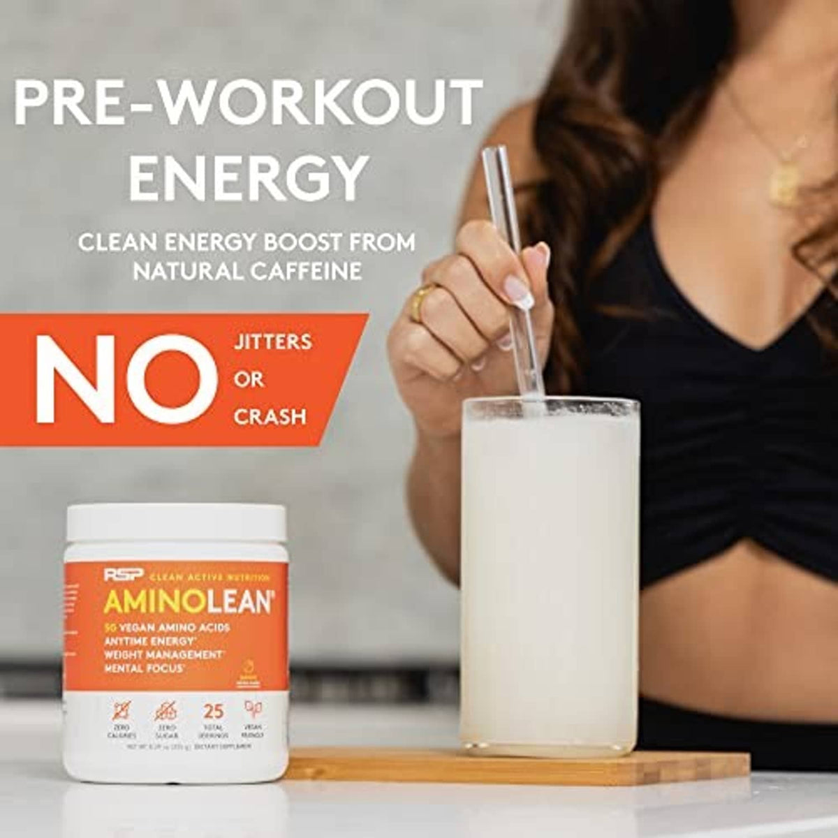 AminoLean pre-workout powder jar with orange label, shown near a filled cup
