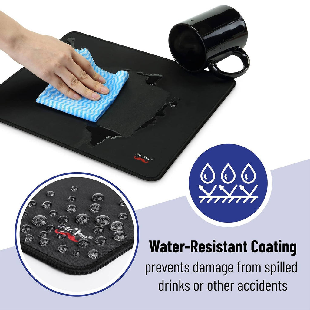 Black mouse pad with water-resistant coating, being wiped clean with a cloth.