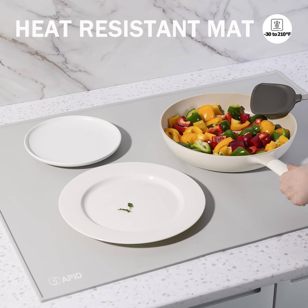Gray heat-resistant silicone mat with raised rim, place plates and cookware on it