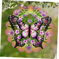 Hanging butterfly wind spinner with purple and green accents, layered ring design, center hook.