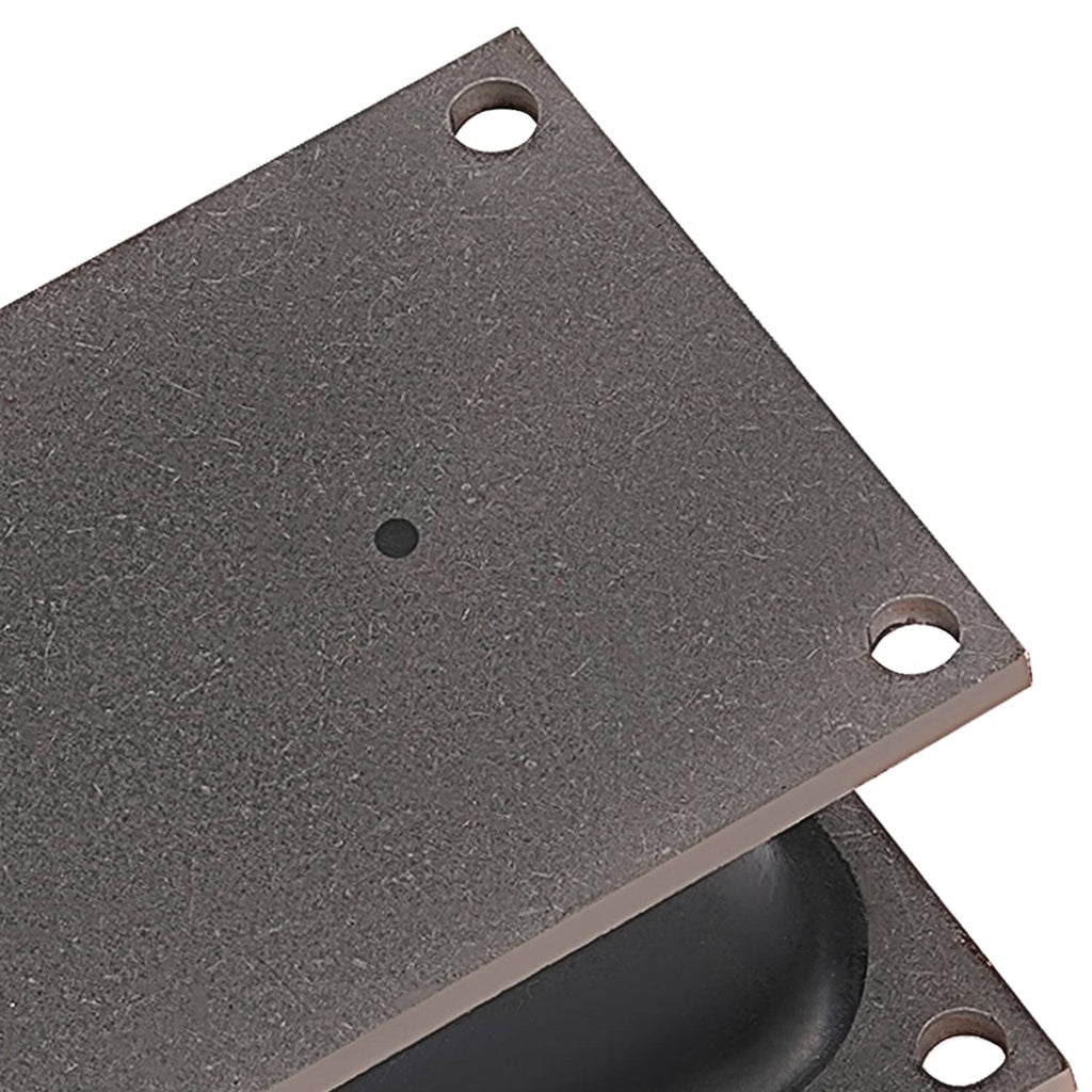 Close-up of rubber shock mount isolator plate with mounting holes and textured surface