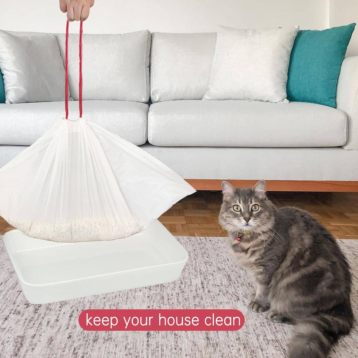White drawstring cat litter liner bag with red rope hanging over litter box
