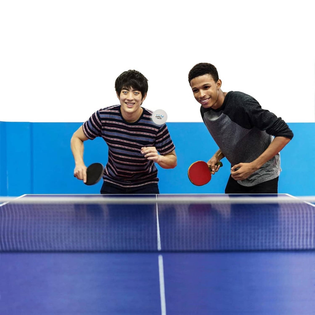 White 3-star table tennis balls on a blue table tennis table