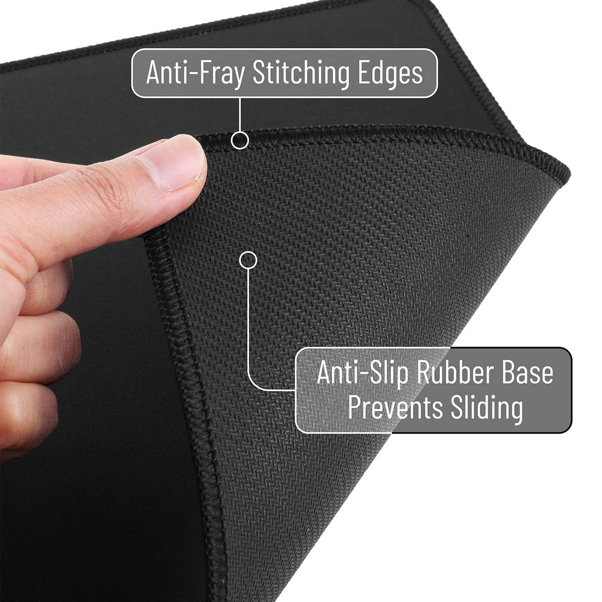 Black mouse pad corner with anti-fray stitching and textured fabric surface.