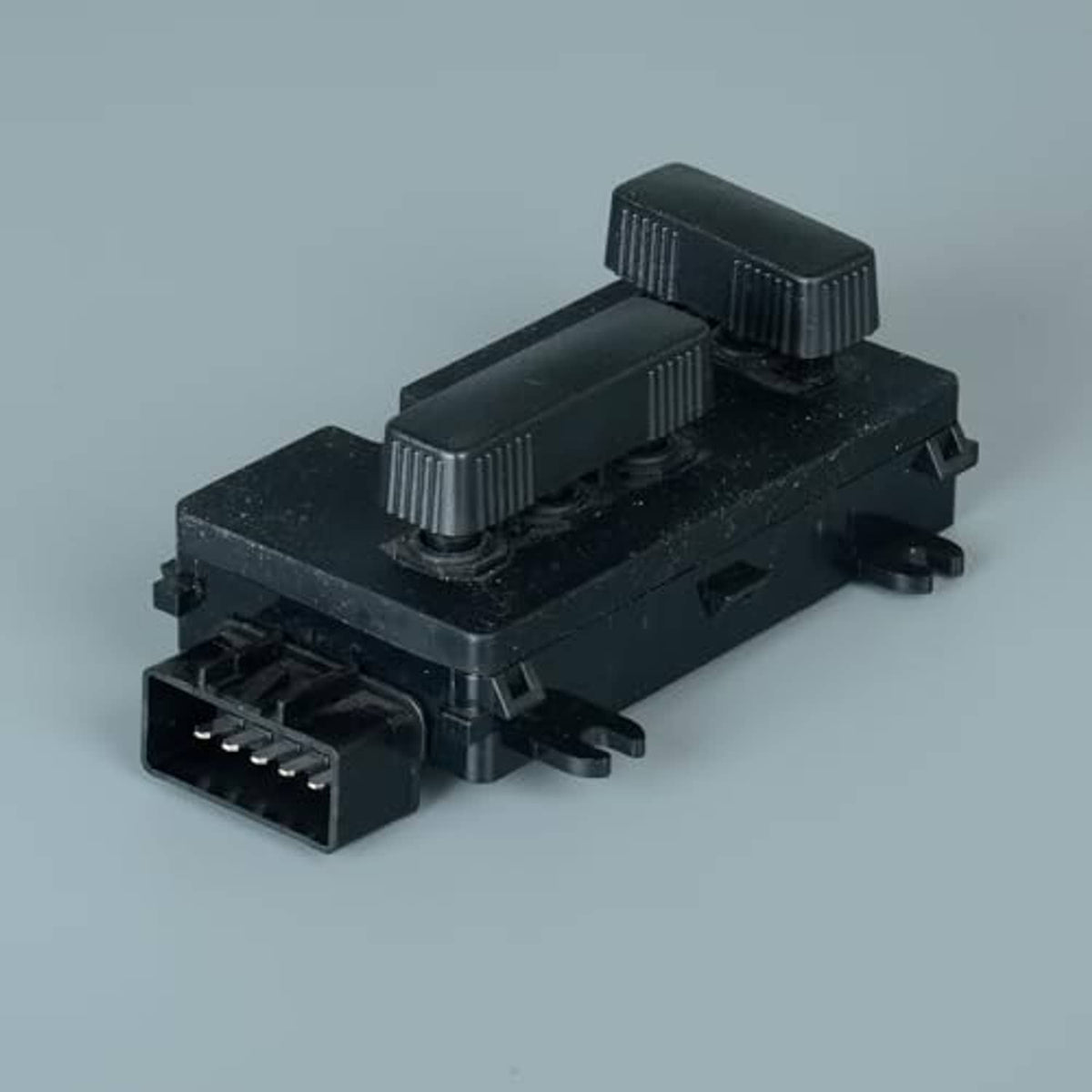 Black power seat switch adjust module with ribbed levers and front wiring socket