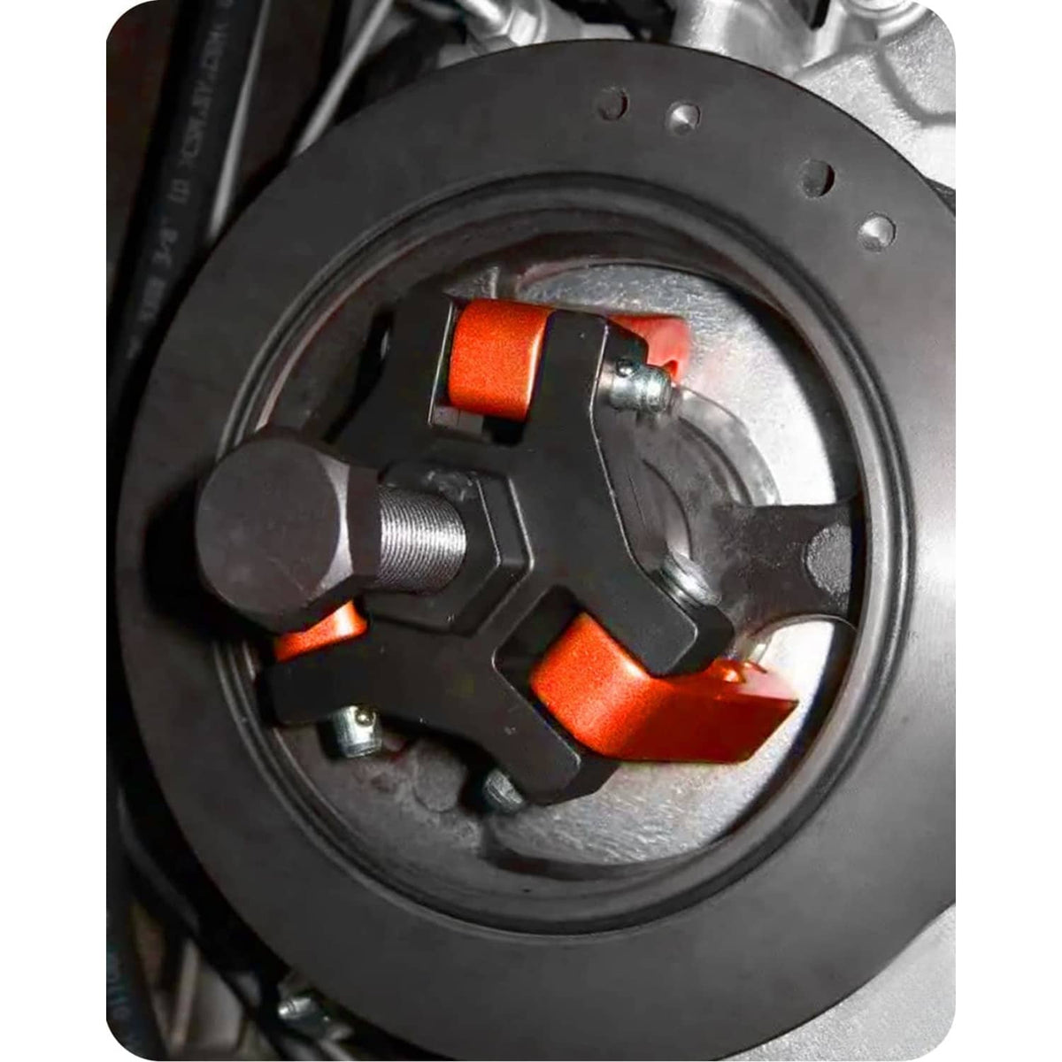 3-jaw harmonic balancer puller gripping inside of a pulley hub