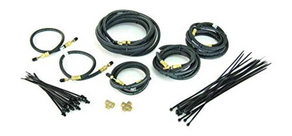 Trailer brake line kit with multiple coiled hydraulic hoses, end fittings, and mounting clips