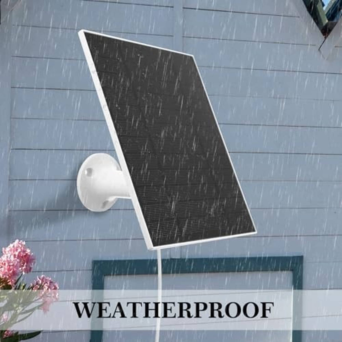 Black flexible solar panel on white wall mount, in light rain with droplets visible
