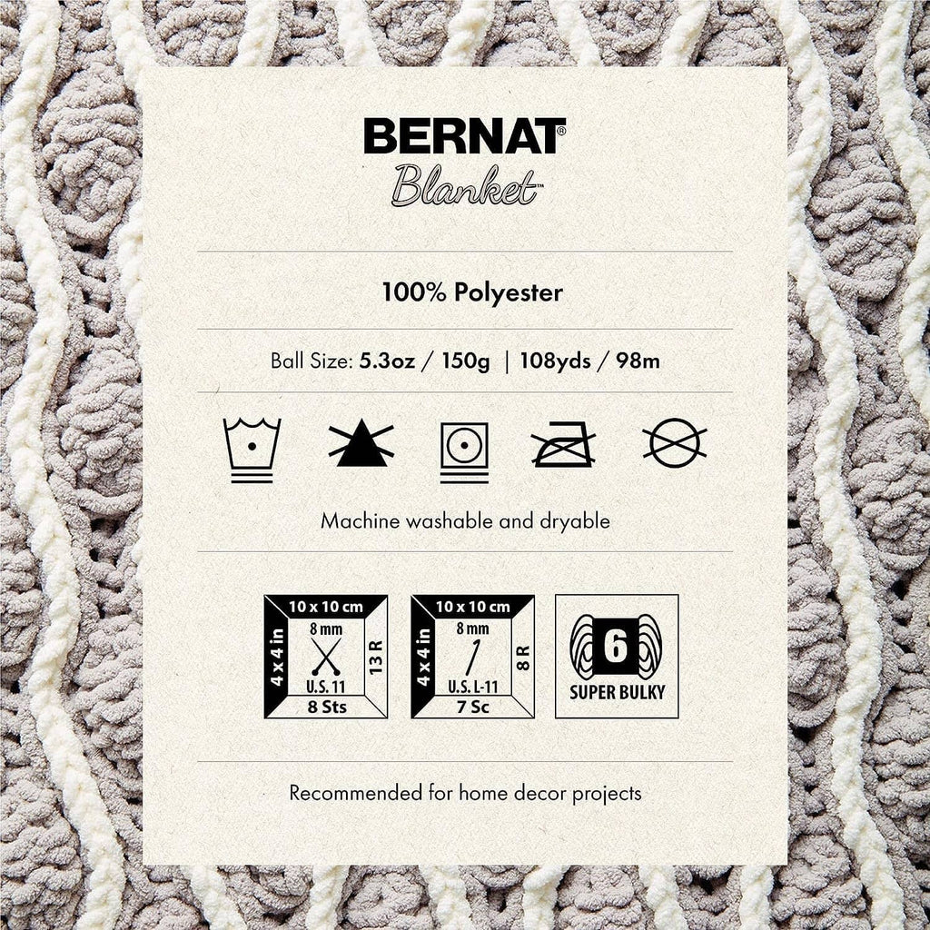 Yarn information label on textured fabric with size and care icons