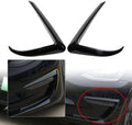 Gloss black front fog light eyebrow cover trim, curved pair pieces shown close-up