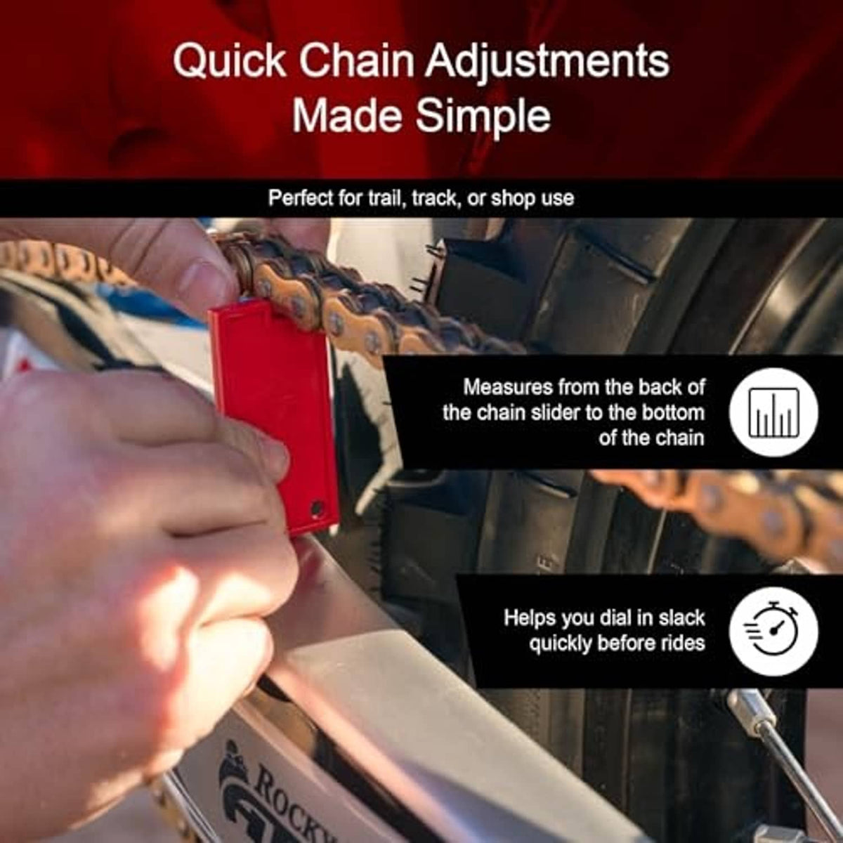 Red chain slack measuring tool held against a motorcycle chain by two hands