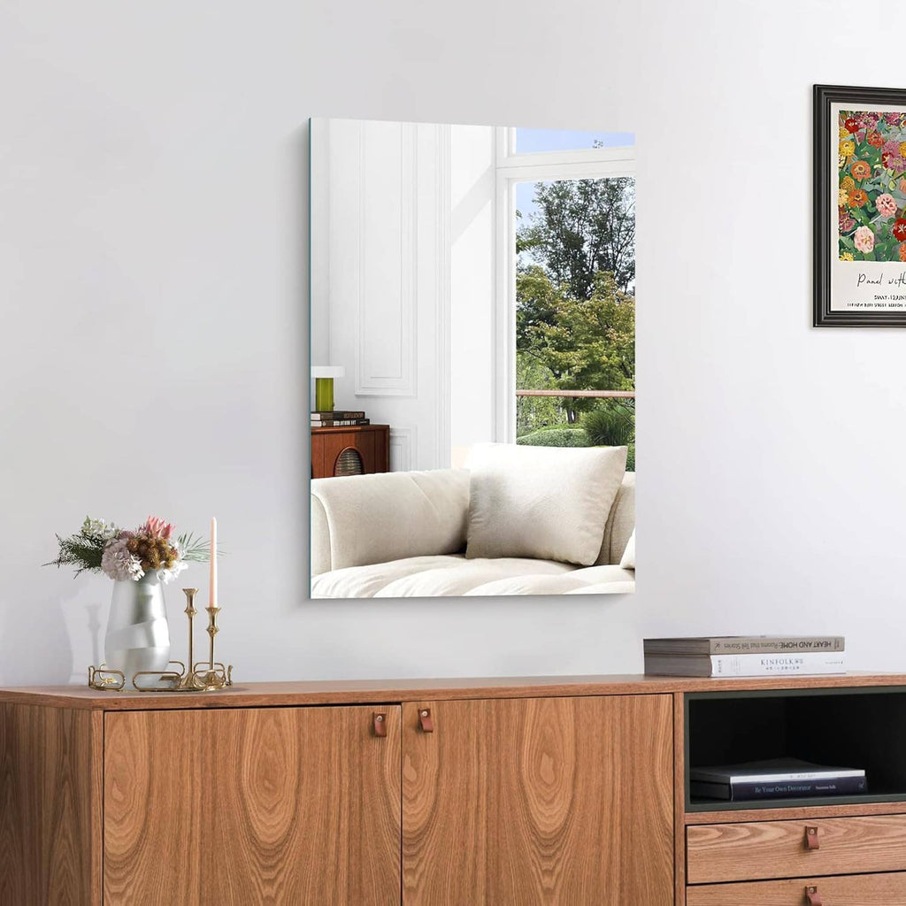 Unframed square-rectangle mirror mounted on wall with edge-to-edge reflective glass