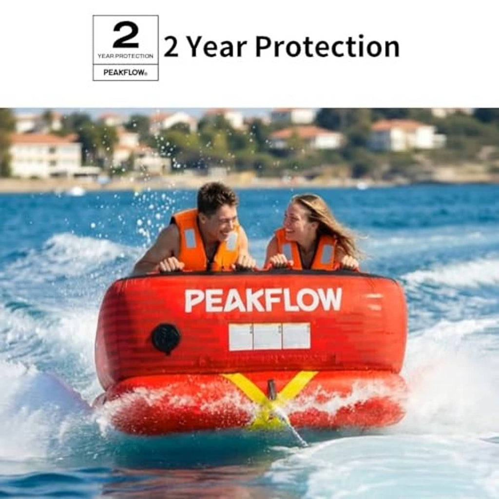 Red PEAKFLOW towable tube with two riders; label reads 2 year protection